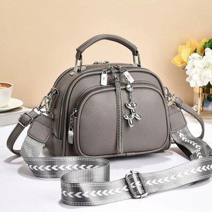 Сумка жіноча кросбоді  на 1 відділ з короткою ручкою,а також тексильним ремінцем через плече сіра 00095 фото
